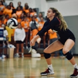 Girls Volleyball player about to hit ball